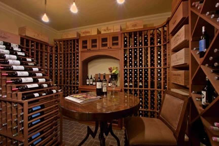 A true wine cellar is tucked away in the fully finished basement. With a 1600-bottle capacity, the wine room is conditioned for the accurate temperature, has insulated glass, a vapor-barrier system, and is finished with brick pavers.