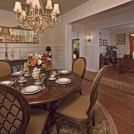 Wainscoting is carried through to the elegantly-appointed dining room. Crown moulding accentuates the contrasting hue of the ceiling.