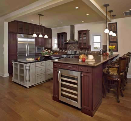 Despite its turn-of-the-century design, the kitchen is completely contemporary in functionality. A built-in wine cooler, built-in hutch, furniture-grade cabinetry, oversized island with a contrasting painted finish, Silestone® countertops, oversized refrigerator, and an intricate tile design for the backsplash make this an ultimate spot for memorable gatherings.