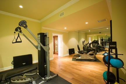 The exercise room is a spacious 27 feet x 14 feet in size. Located in the basement, it is equipped with the latest exercise equipment, wall-to-wall mirrors, and a high definition television monitor.