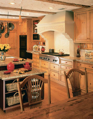 The focal point of the kitchen is a custom limestone hearth. An arts and crafts station placed at a lower height is designed for the children.