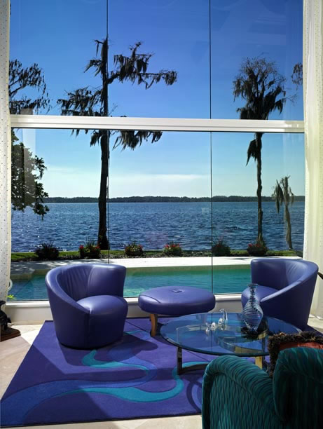 The commanding water view has the power to mesmerize and relax all who experience this dramatic space. A solid expanse of 17-foot high butt-glaze windows maximizes this breathtaking view from the great room, dining room, and second floor loft as well as the den and library.